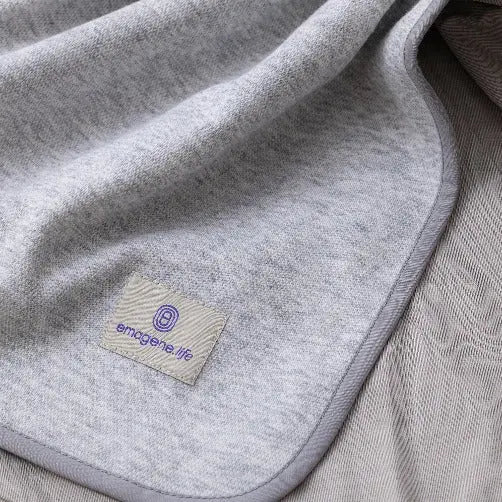 Soft grey Emagene Life blanket with logo tag, functional medicine wellness product Malaysia