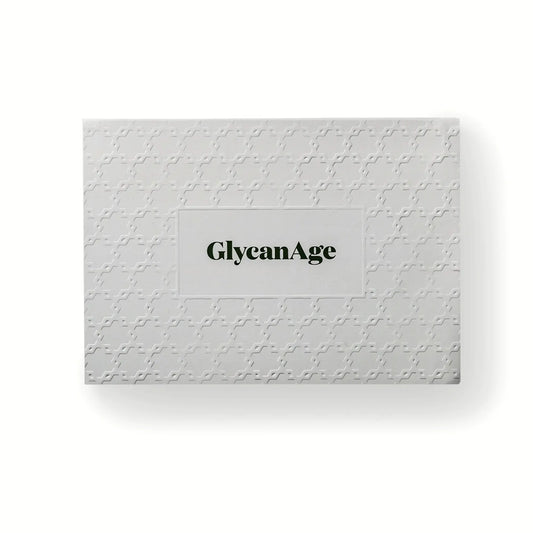 GlycanAge test kit box with white embossed geometric pattern, functional medicine branding