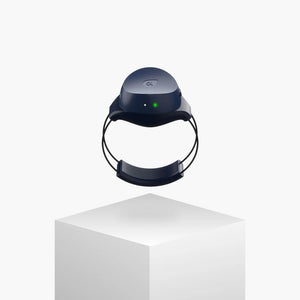 Navy blue electronic device with a green light on a white background